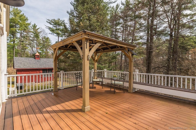 wooden terrace featuring a gazebo