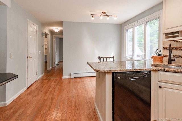 kitchen featuring light wood-style flooring, tasteful backsplash, a baseboard heating unit, dishwasher, and a sink