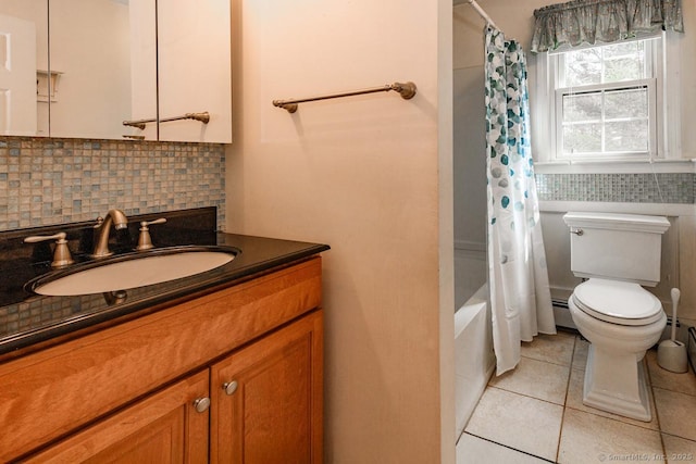 full bath with vanity, toilet, a baseboard radiator, decorative backsplash, and tile patterned floors