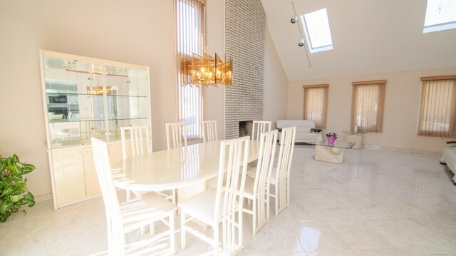 955 Dunbar Hill Rd, Hamden, CT 06514 - dining area with a towering ceiling, a skylight, a chandelier, and a fireplace