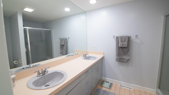 955 Dunbar Hill Rd, Hamden, CT 06514 - full bathroom featuring a shower stall, baseboards, double vanity, and recessed lighting