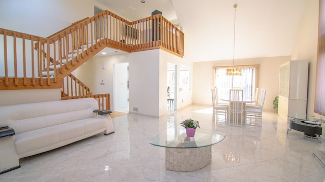 955 Dunbar Hill Rd, Hamden, CT 06514 - living area featuring a high ceiling, a chandelier, marble tiled flooring, and stairs