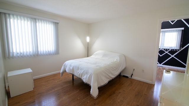 955 Dunbar Hill Rd, Hamden, CT 06514 - bedroom featuring multiple windows, baseboards, and wood finished floors