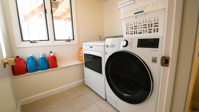 955 Dunbar Hill Rd, Hamden, CT 06514 - laundry area with washing machine and clothes dryer, light tile patterned floors, and baseboards