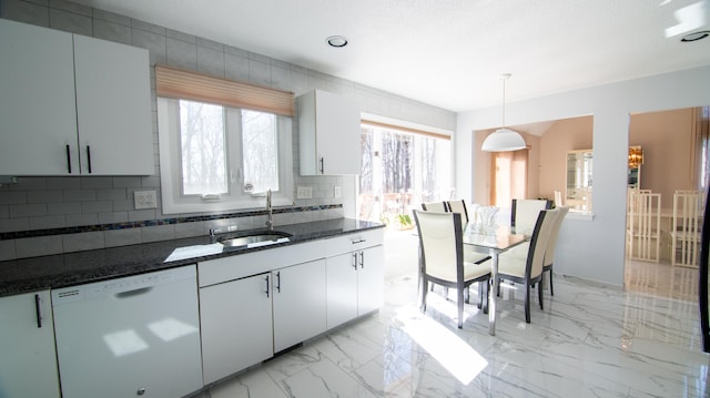955 Dunbar Hill Rd, Hamden, CT 06514 - kitchen featuring white dishwasher, a sink, tasteful backsplash, dark stone countertops, and hanging light fixtures