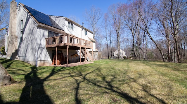 955 Dunbar Hill Rd, Hamden, CT 06514 - rear view of house with stairway, a wooden deck, a yard, a chimney, and a patio area