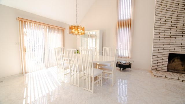 955 Dunbar Hill Rd, Hamden, CT 06514 - dining area featuring a chandelier, a fireplace, high vaulted ceiling, and marble finish flooring