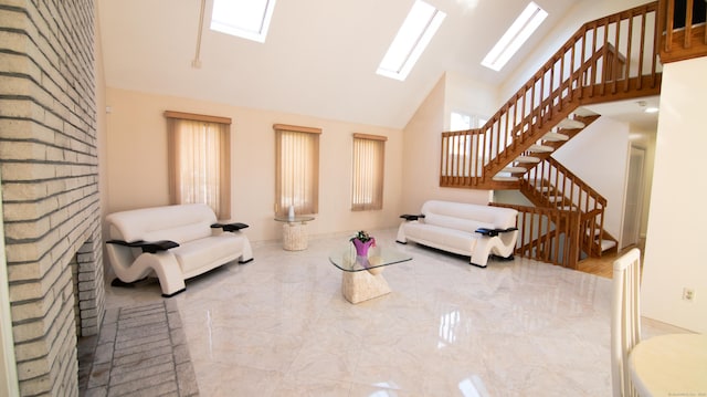 955 Dunbar Hill Rd, Hamden, CT 06514 - living room with a skylight, high vaulted ceiling, stairway, marble tiled flooring, and healthy amount of natural light