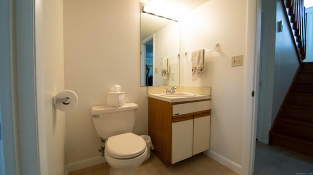 955 Dunbar Hill Rd, Hamden, CT 06514 - bathroom with toilet, vanity, baseboards, and tile patterned flooring