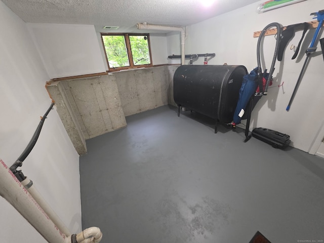 955 Dunbar Hill Rd, Hamden, CT 06514 - basement with heating fuel and a textured ceiling