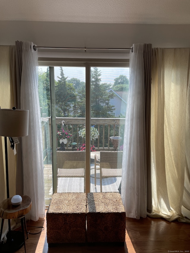 doorway to outside featuring wood finished floors