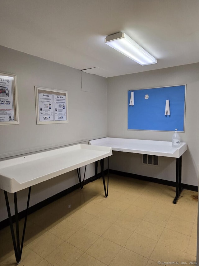 miscellaneous room featuring visible vents and light floors