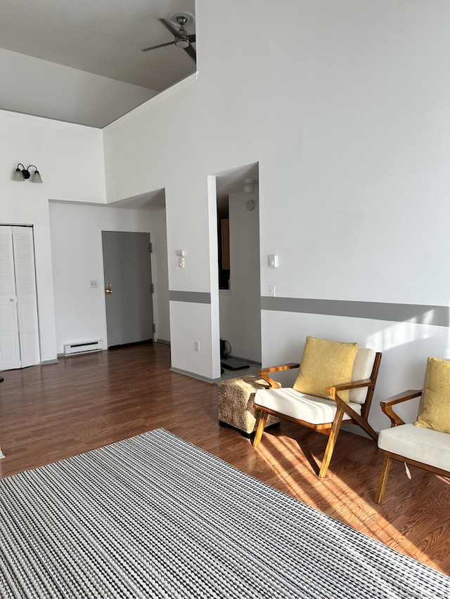 3699 Broadbridge Ave Unit 330, Stratford, CT 06614 - sitting room with a towering ceiling, ceiling fan, wood finished floors, and a baseboard heating unit