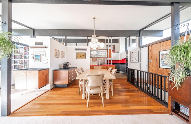 dining room featuring an inviting chandelier and wood finished floors