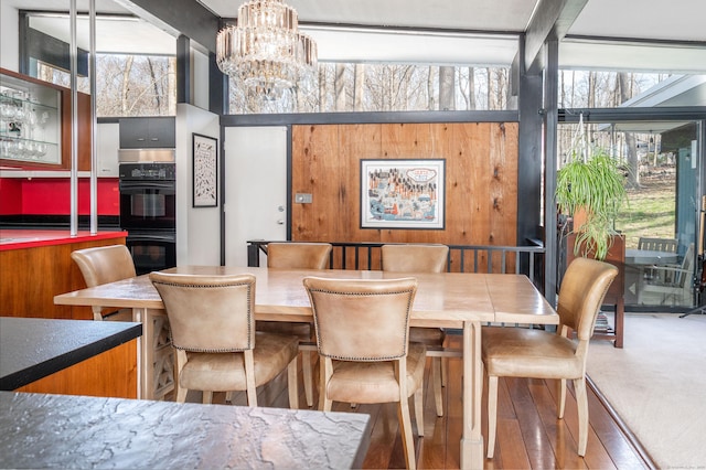 dining room featuring a chandelier and wood finished floors
