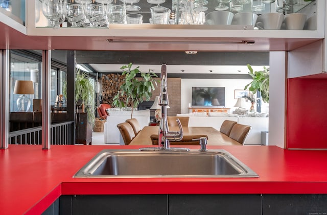 kitchen with open floor plan and a sink