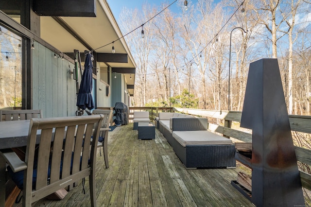 deck featuring an outdoor living space and grilling area
