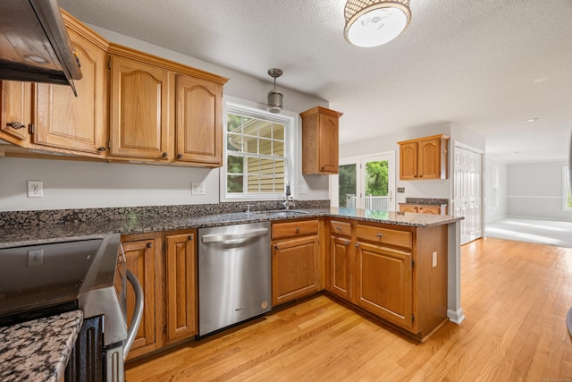 40 Nathan Hale Ct, Cheshire, CT 06410 - kitchen with stainless steel appliances, light wood-style flooring, extractor fan, dark stone countertops, and a peninsula