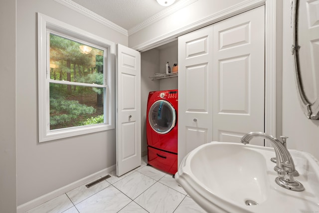 40 Nathan Hale Ct, Cheshire, CT 06410 - washroom featuring ornamental molding, plenty of natural light, baseboards, washer / dryer, and light marble finish flooring