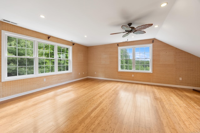 40 Nathan Hale Ct, Cheshire, CT 06410 - empty room featuring light wood finished floors, plenty of natural light, a ceiling fan, baseboards, and vaulted ceiling