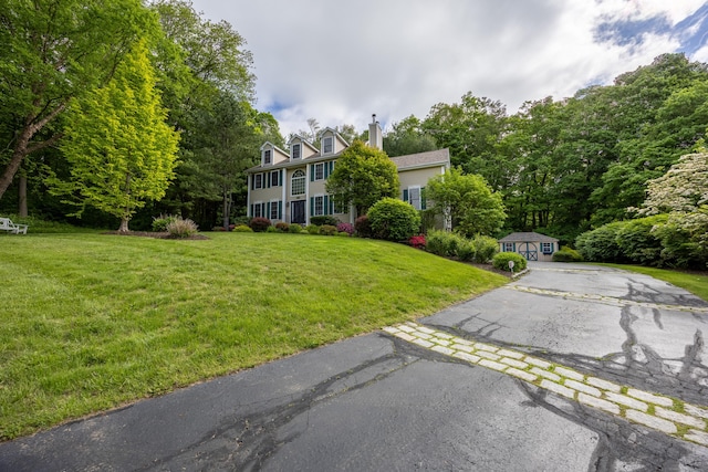 40 Nathan Hale Ct, Cheshire, CT 06410 - view of green lawn with asphalt driveway and view of scattered trees