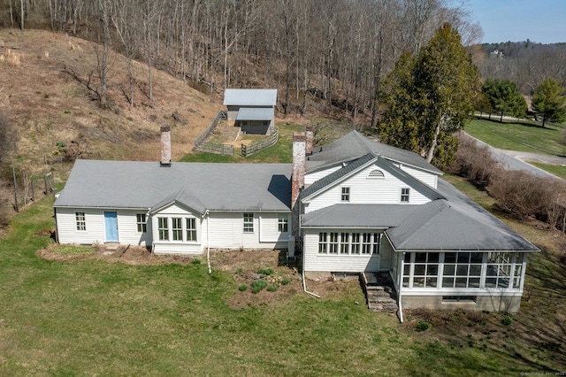 265 Housatonic River Rd, Salisbury, CT 06068 - rear view of house with a lawn, a chimney, and a sunroom