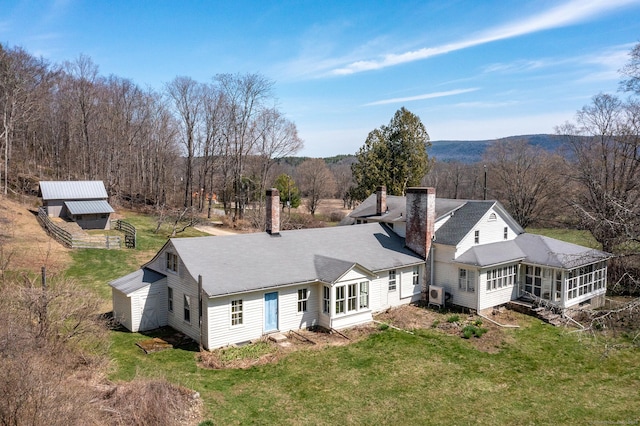 265 Housatonic River Rd, Salisbury, CT 06068 - rear view of property with a chimney, a lawn, a storage shed, an outbuilding, and a sunroom