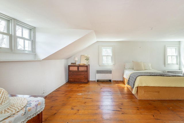 265 Housatonic River Rd, Salisbury, CT 06068 - bedroom with radiator, baseboards, hardwood / wood-style flooring, and lofted ceiling