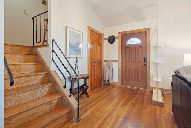93 Lyman Rd, West Hartford, CT 06117 - entryway with lofted ceiling, light wood-type flooring, and stairway