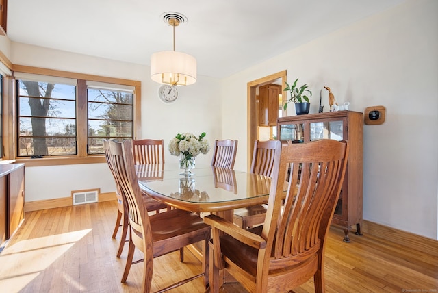 93 Lyman Rd, West Hartford, CT 06117 - dining area with light wood-type flooring, baseboards, and visible vents
