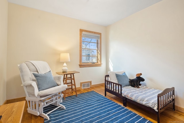 93 Lyman Rd, West Hartford, CT 06117 - sitting room with wood finished floors, visible vents, and baseboards