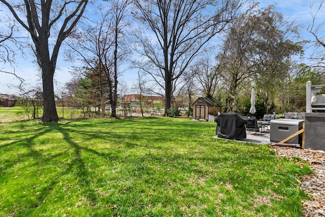 93 Lyman Rd, West Hartford, CT 06117 - view of yard with an outbuilding, a storage shed, and fence