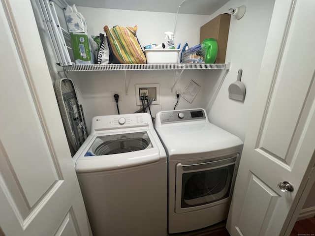 laundry area featuring washer and dryer and laundry area