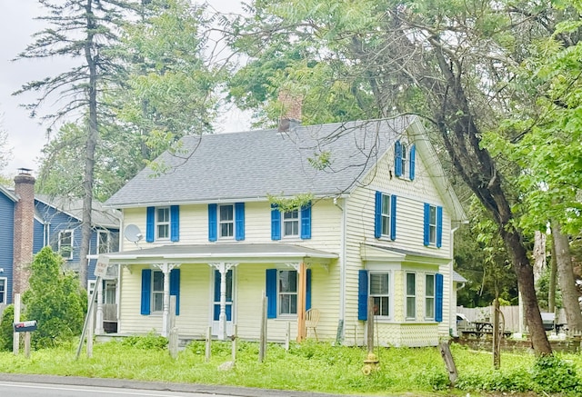 152 Partrick Ave, Norwalk, CT 06851 - view of front of property with covered porch, a shingled roof, and a chimney