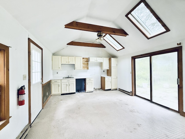 152 Partrick Ave, Norwalk, CT 06851 - unfurnished living room featuring a skylight, light carpet, ceiling fan, and a sink