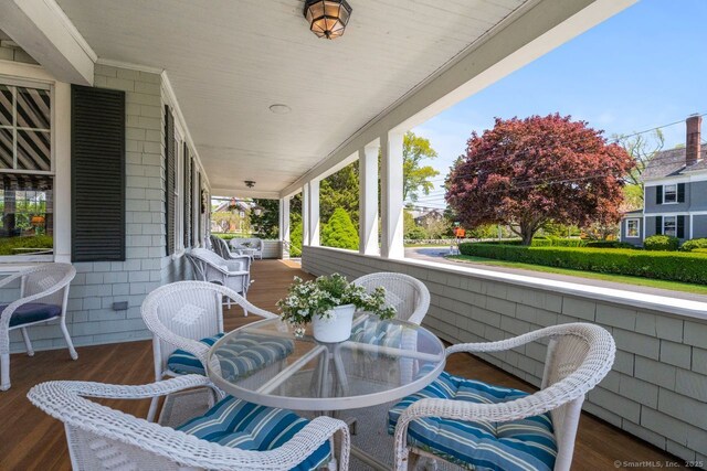 86 Tyler Ave, Groton, CT 06340 - wooden deck with covered porch and outdoor dining space
