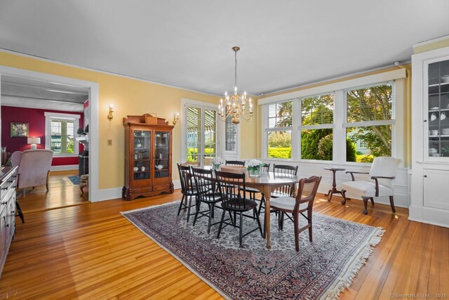 86 Tyler Ave, Groton, CT 06340 - dining space with a chandelier and light wood-type flooring
