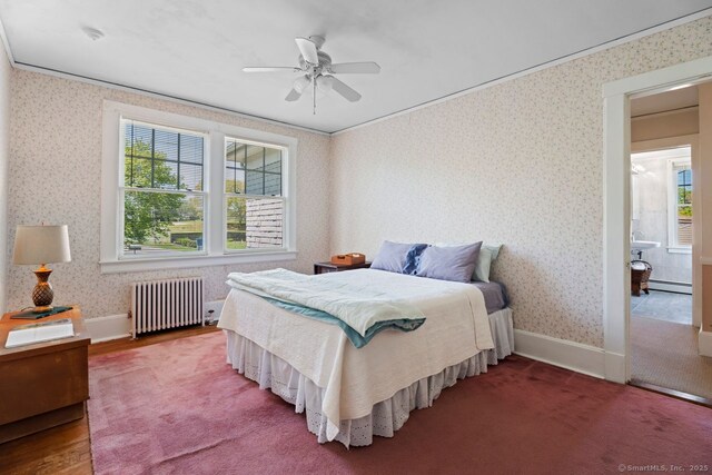 86 Tyler Ave, Groton, CT 06340 - bedroom with radiator, multiple windows, a baseboard radiator, wallpapered walls, and crown molding