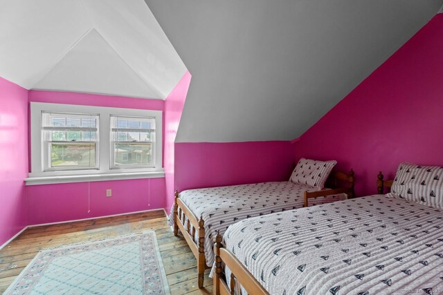 86 Tyler Ave, Groton, CT 06340 - bedroom with hardwood / wood-style floors and vaulted ceiling