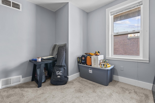 carpeted home office featuring baseboards and visible vents
