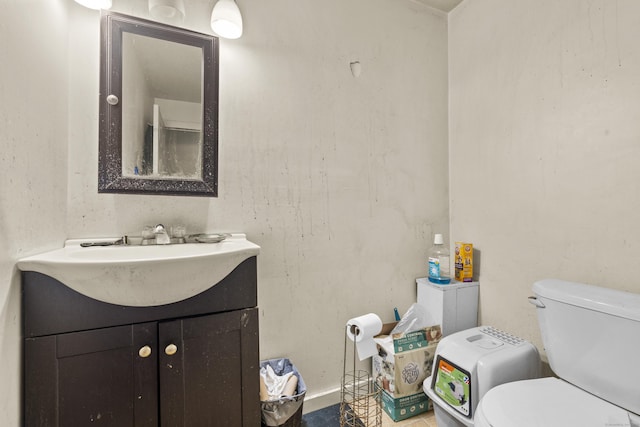 half bath featuring toilet and vanity