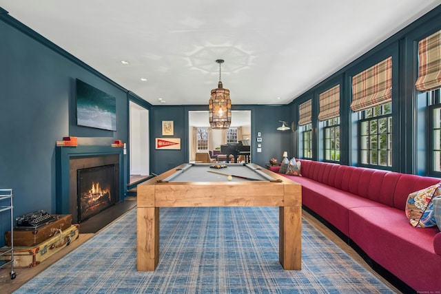 358 Lukes Wood Rd, New Canaan, CT 06840 - game room with a lit fireplace, pool table, ornamental molding, wood finished floors, and recessed lighting