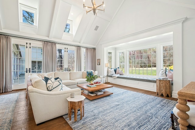 358 Lukes Wood Rd, New Canaan, CT 06840 - living room featuring high vaulted ceiling, wood finished floors, french doors, a chandelier, and beam ceiling