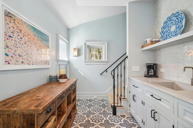 358 Lukes Wood Rd, New Canaan, CT 06840 - stairway featuring vaulted ceiling and baseboards