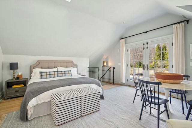 358 Lukes Wood Rd, New Canaan, CT 06840 - bedroom with access to outside, vaulted ceiling, wood finished floors, and french doors