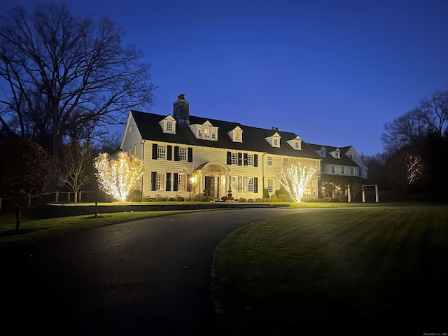 358 Lukes Wood Rd, New Canaan, CT 06840 - view of front facade featuring a chimney and curved driveway