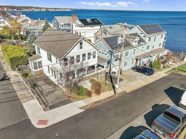 aerial view featuring a water view and a residential view