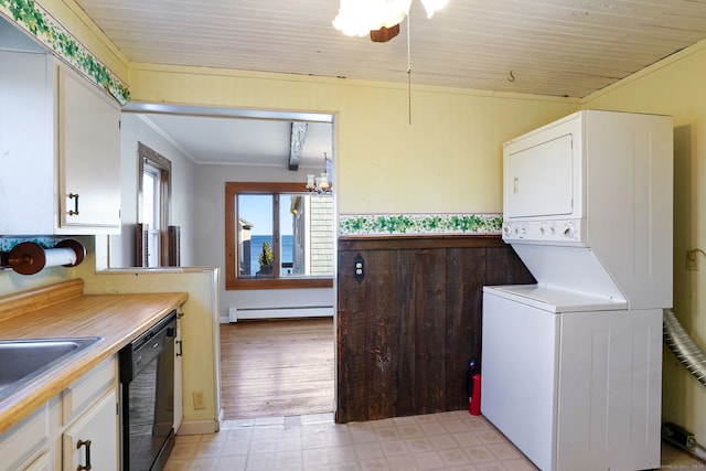 interior space featuring stacked washing maching and dryer, light floors, dishwasher, baseboard heating, and white cabinets
