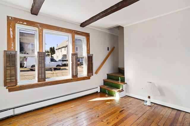 interior space with stairway, a baseboard heating unit, wood-type flooring, baseboards, and beamed ceiling