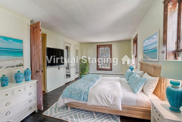 bedroom with dark wood-type flooring